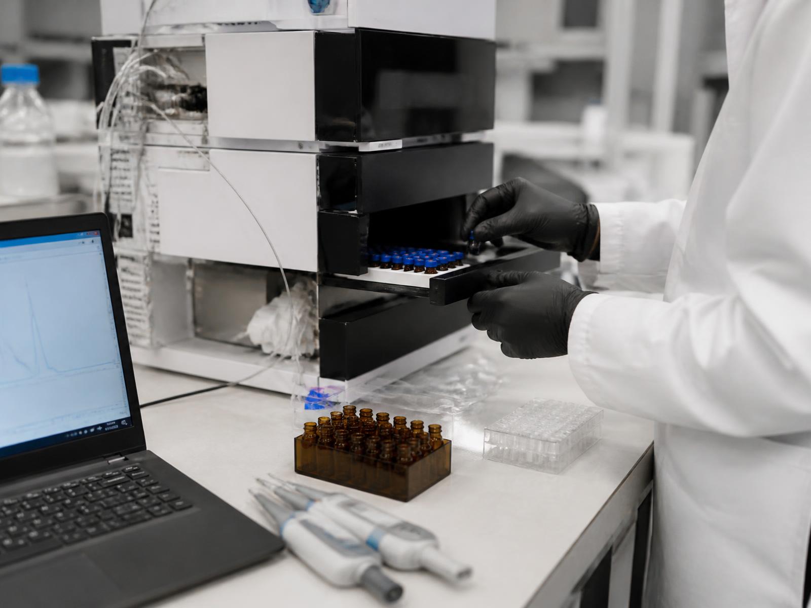 Analyst reviewing chromatography results at the quality control bench in the El Guarco laboratory.